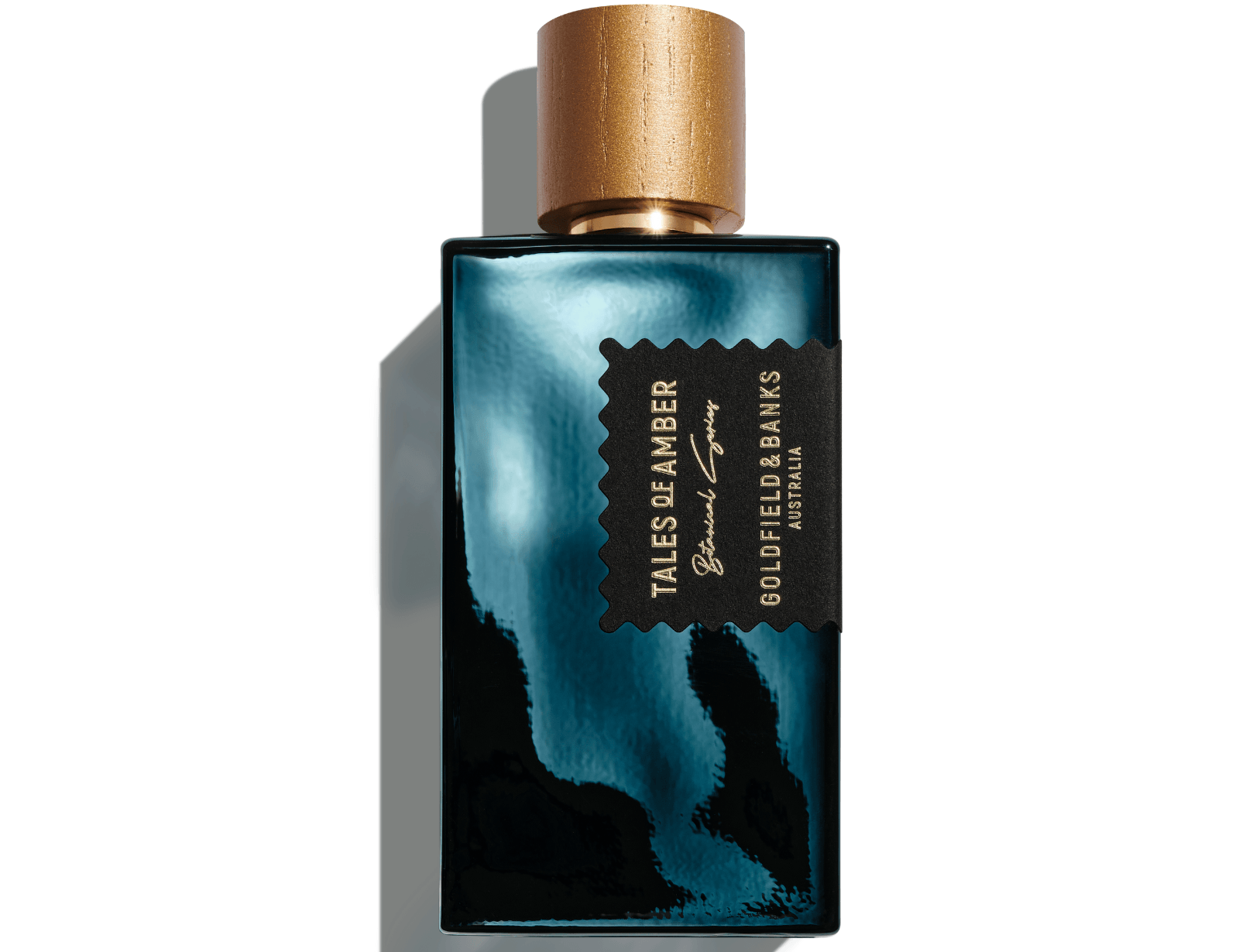 Tales of Amber perfume bottle with black and gold design and wooden cap