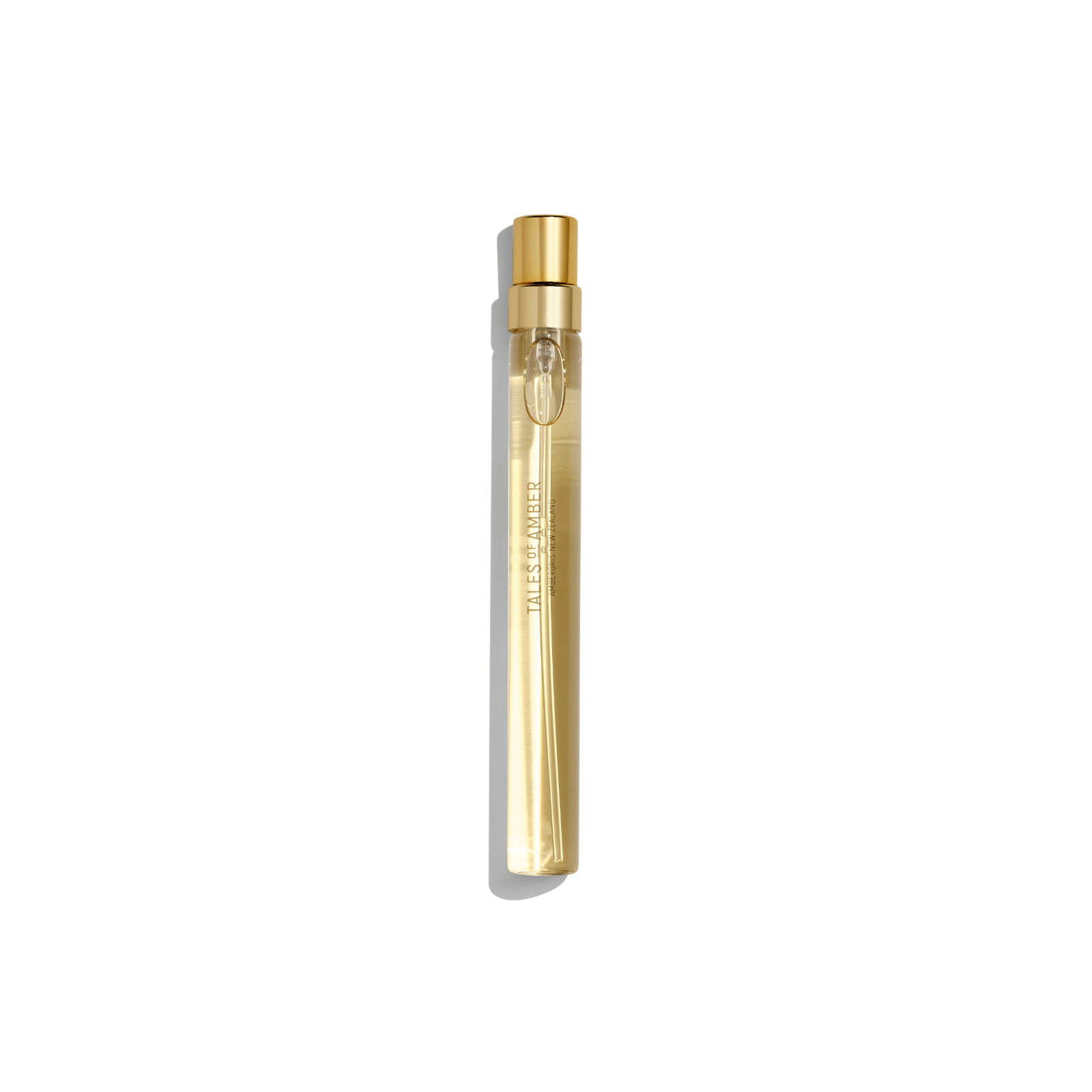 Tales of Amber gold spray perfume bottle on white background